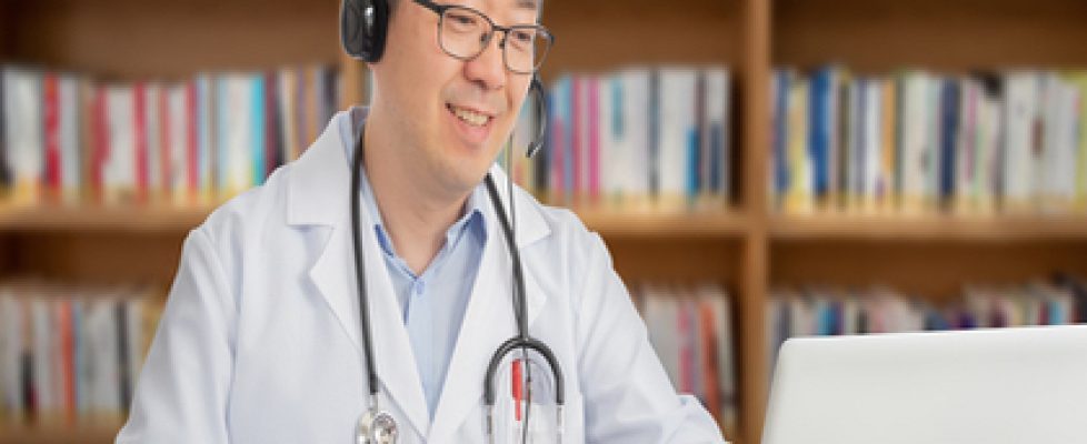 an Asian doctor who is remotely consulting with a patient. Telehealth concept an Asian doctor who is remotely consulting with a patient. Telehealth concept