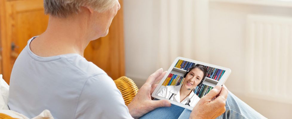 telemedicine concept, old woman with tablet pc during an online consultation with her doctor in her living room telemedicine concept, old woman with tablet pc during an online consultation with her doctor in her living room