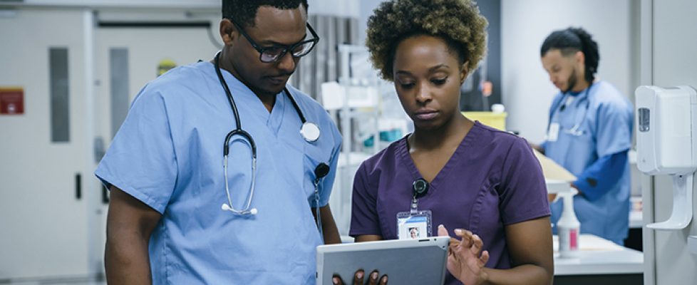 Nurse is using digital tablet in hospital